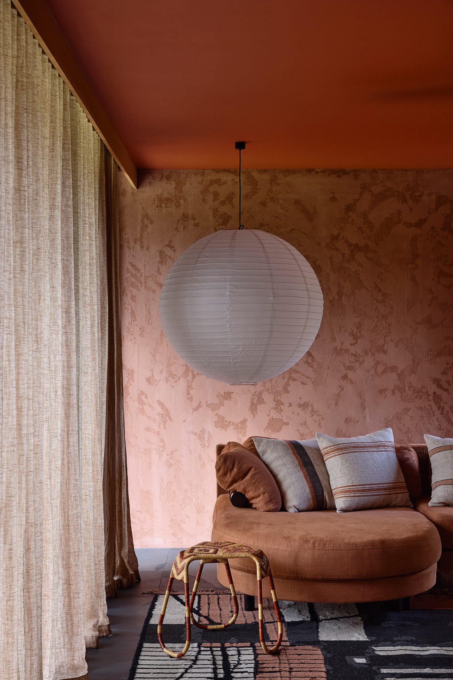 Living room with an earth-toned colour palette at Somers House by Kennedy Nolan