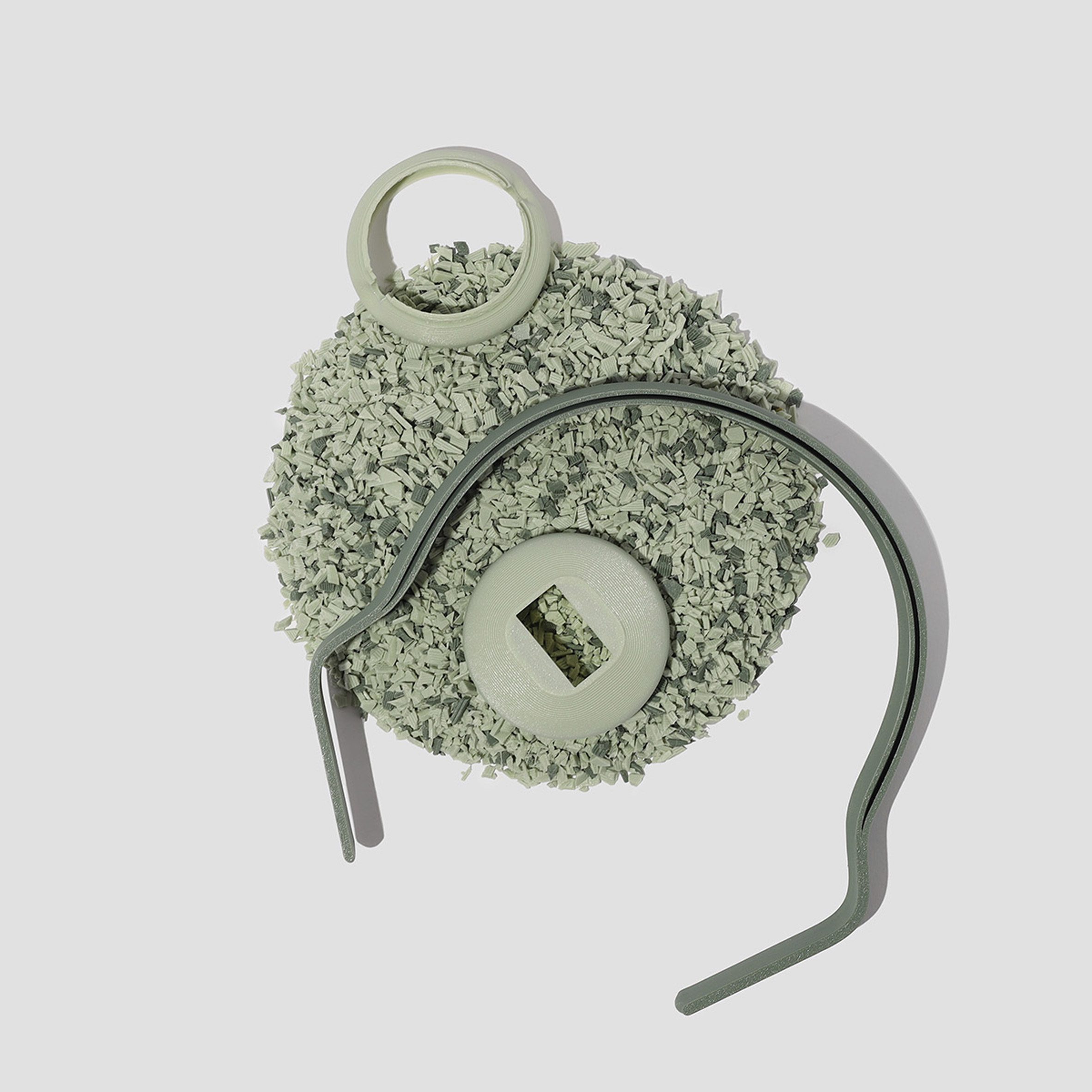 Parts of the headphones in a mint green colour