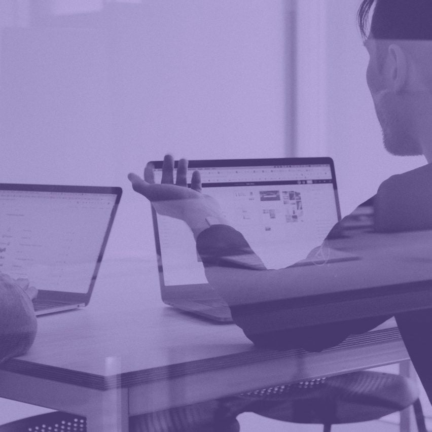 People working at laptops