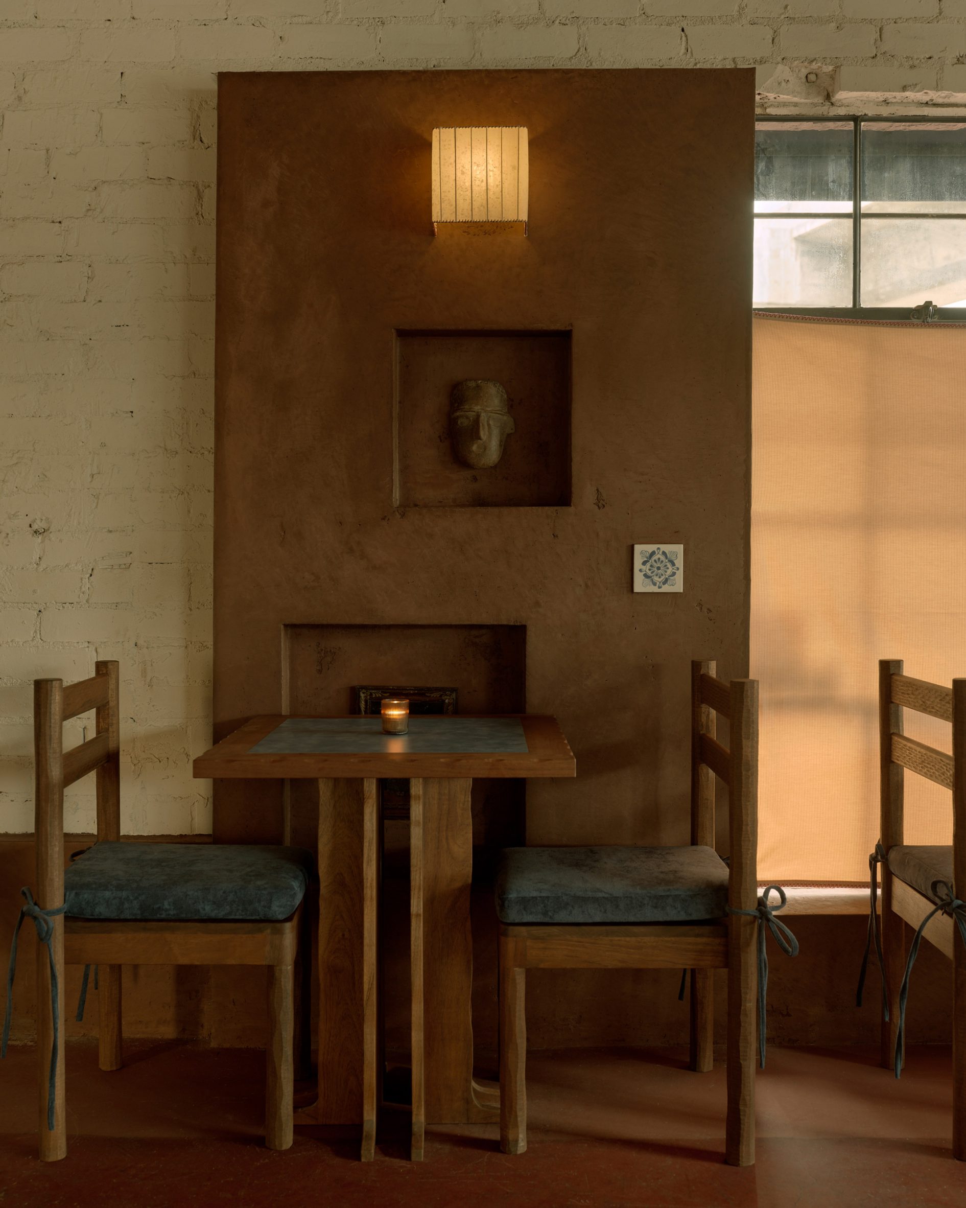 Dining area decorated with warm colours and soft textures