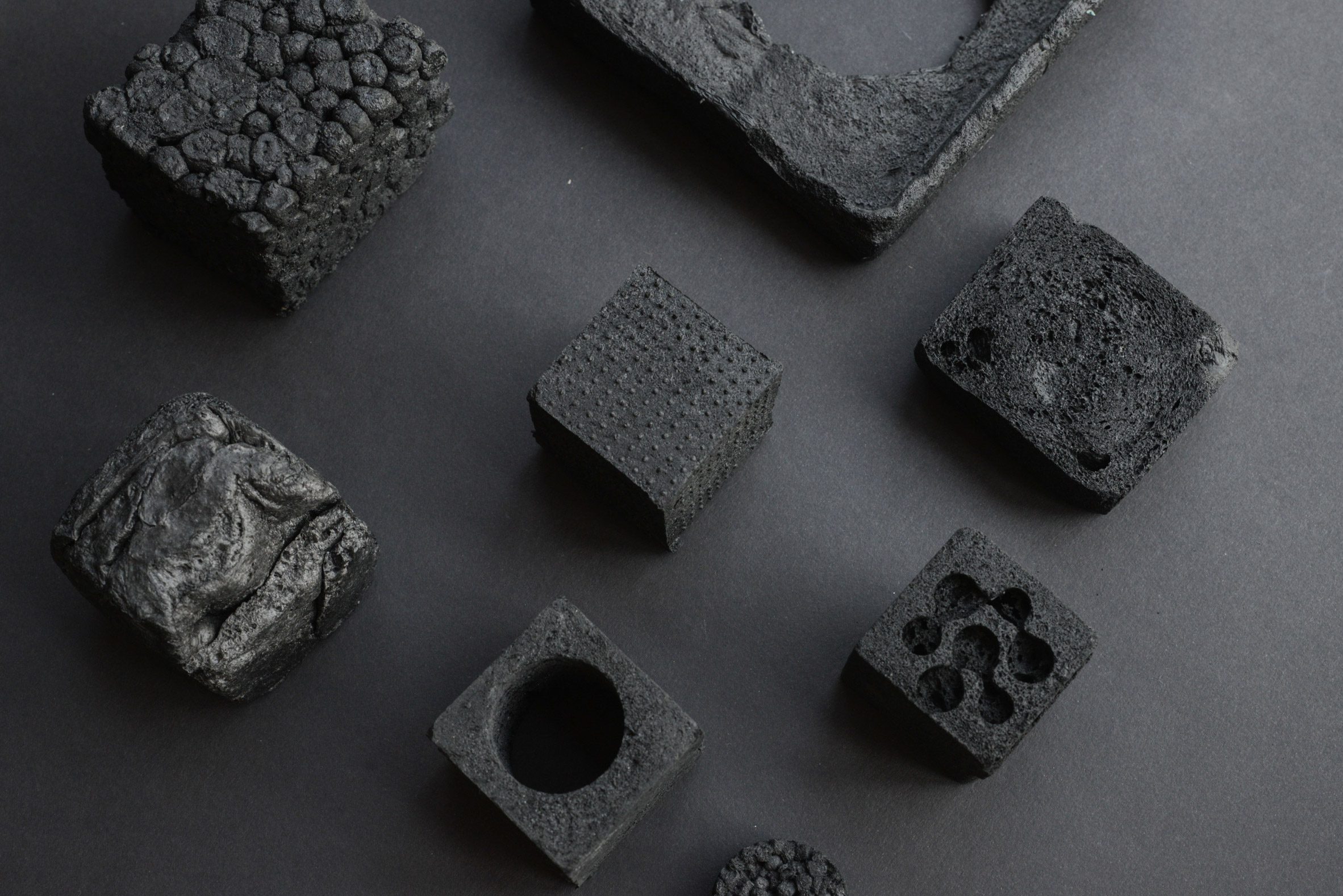 Photo of Carbon Cell black closed-cell foam moulded into various shapes