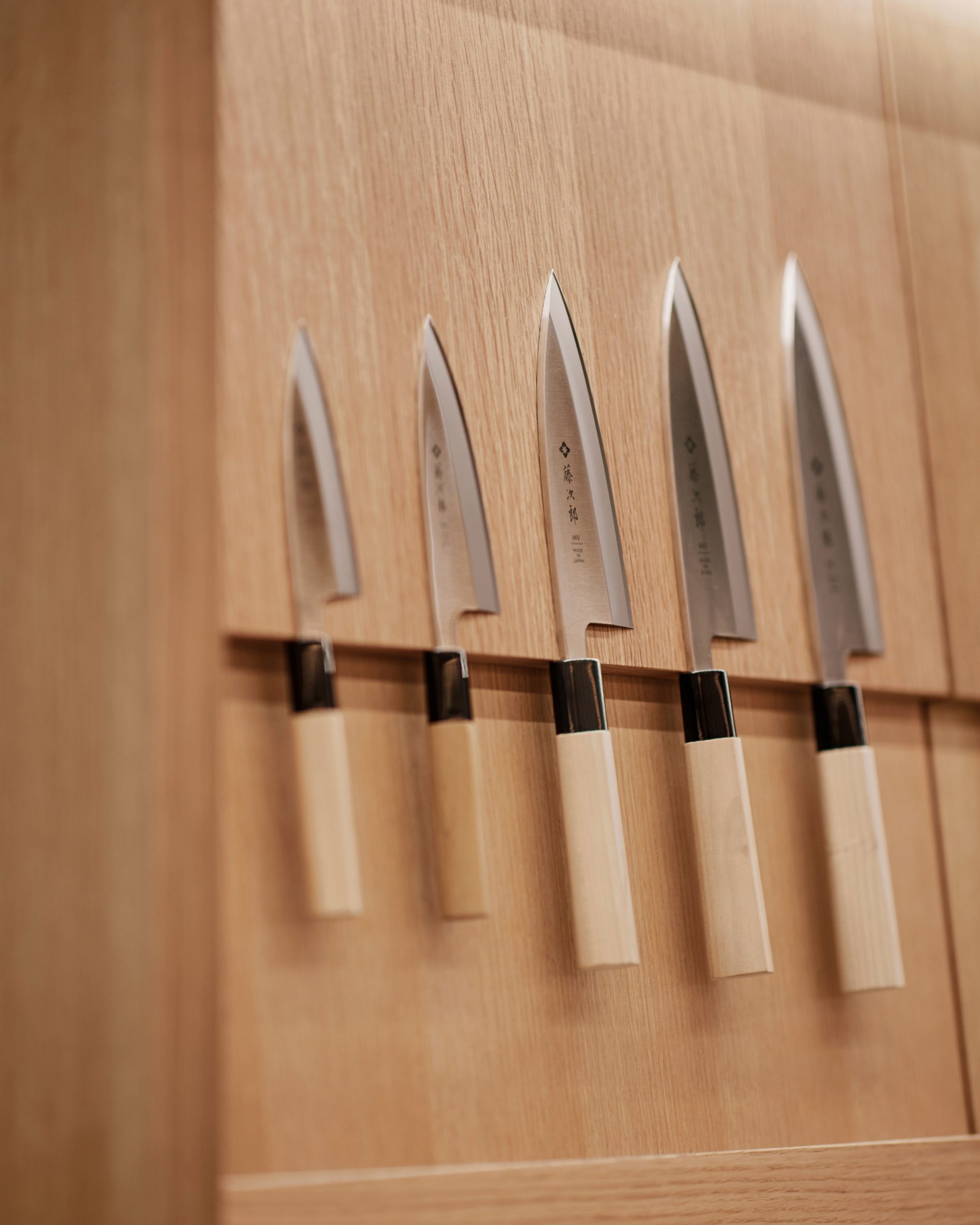 Knives on wooden wall panels