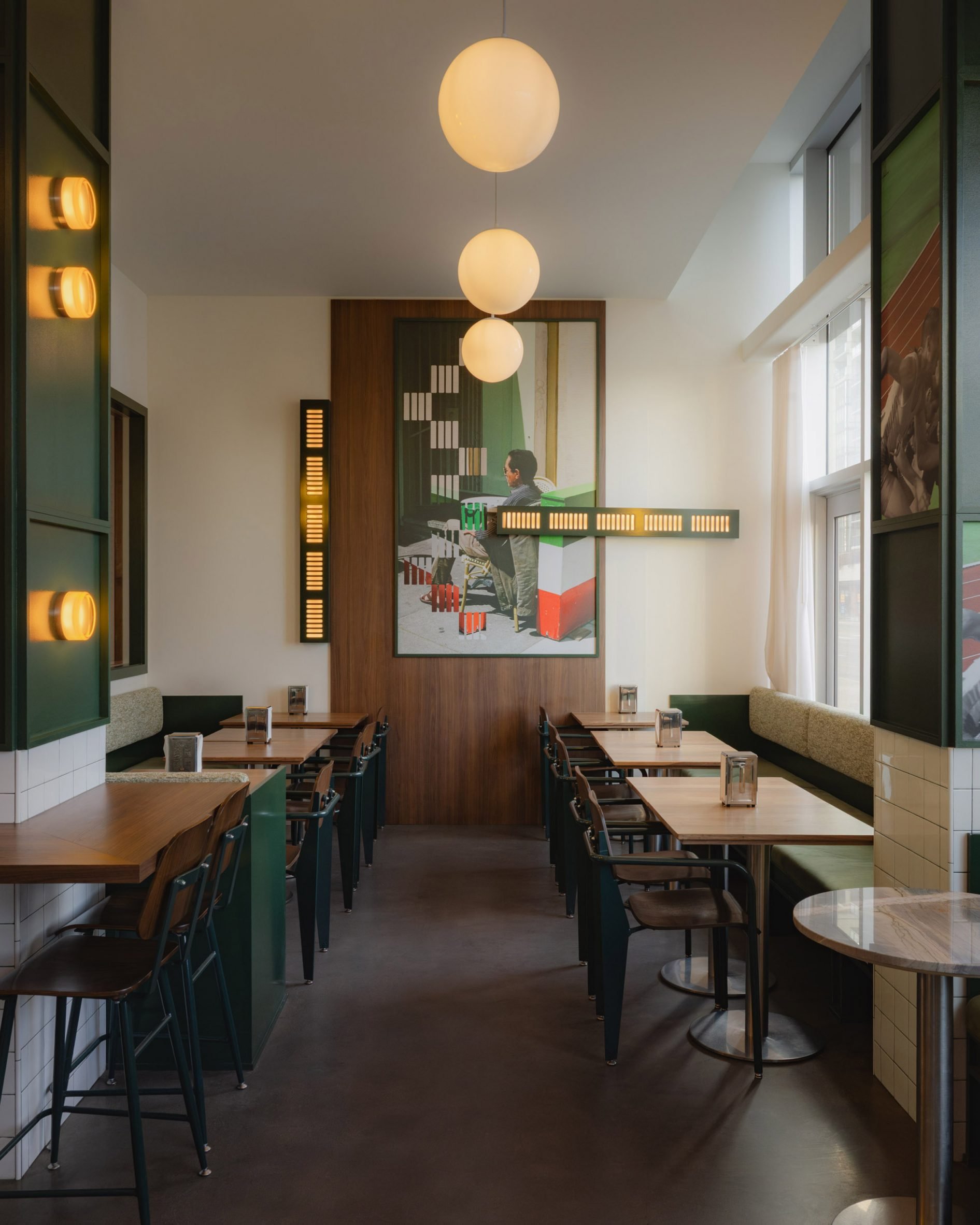 Cafe with hunter green and walnut panelling